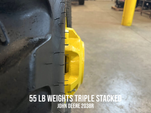 Side View of 55 lb Wheel Weights, Triple Stacked on John Deere 2038R