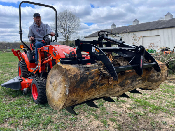 Mini Hydraulic Grapple (SCG-48) for Subcompact Tractors by Worksaver on Kubota BX23s