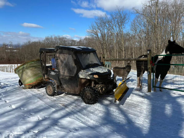 Yard Glider Hauling Hay Bale Behind UTV