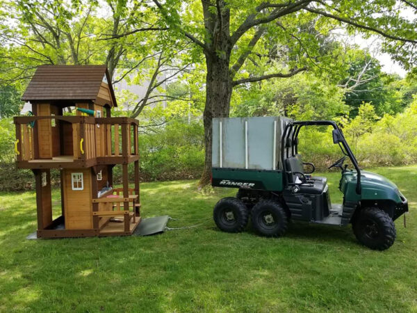 Yard Glider Hauling Jungle Gym Behind UTV