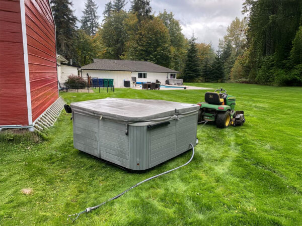 Yard Glider Hauling Jacuzzi Behind Garden Tractor