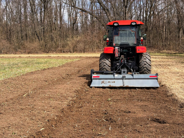 7 ft Dirt Dog Tiller Above Freshly Tilled Soil