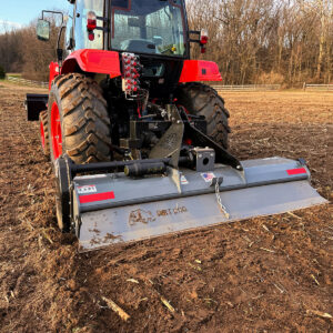 Dirt Dog Tiller In Freshly Tilled Dirt