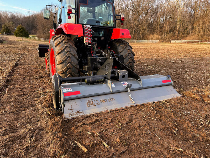 Dirt Dog Tiller In Freshly Tilled Dirt