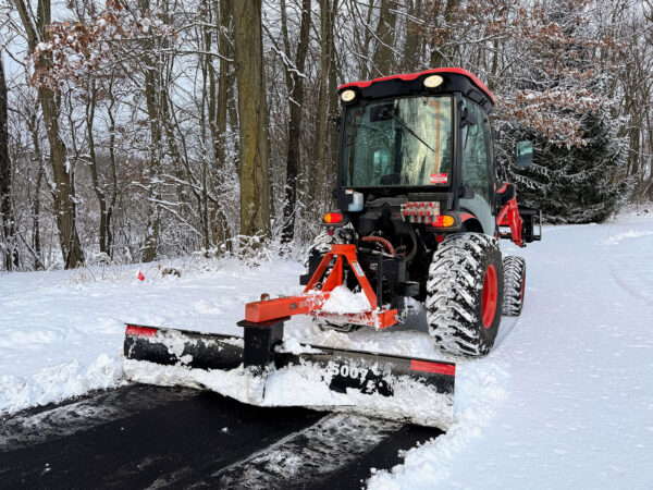 Dirt Dog 5007 Rear Blade Clearing Snow on Paved Driveway