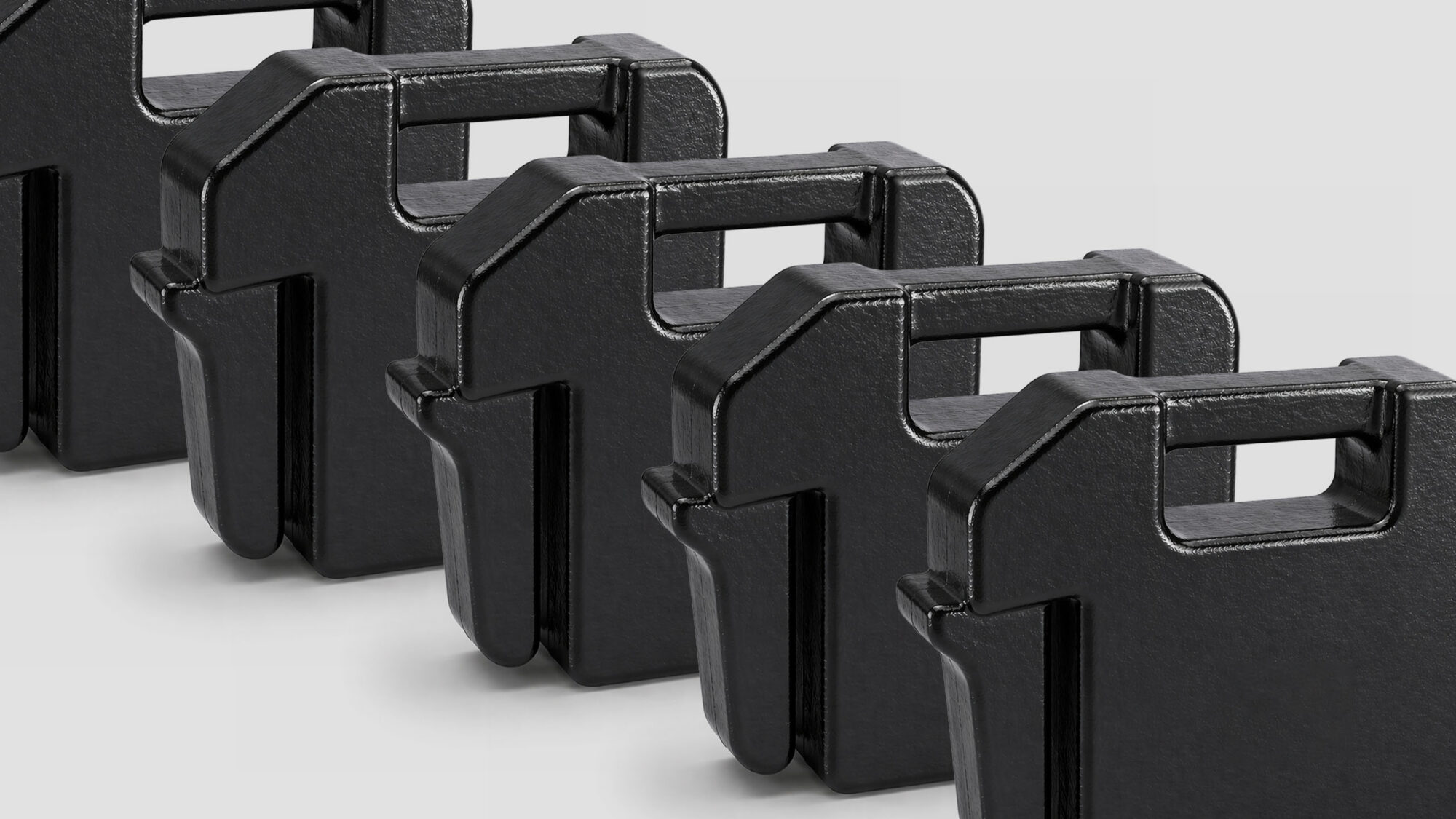 Row of black, cast iron suitcase weights