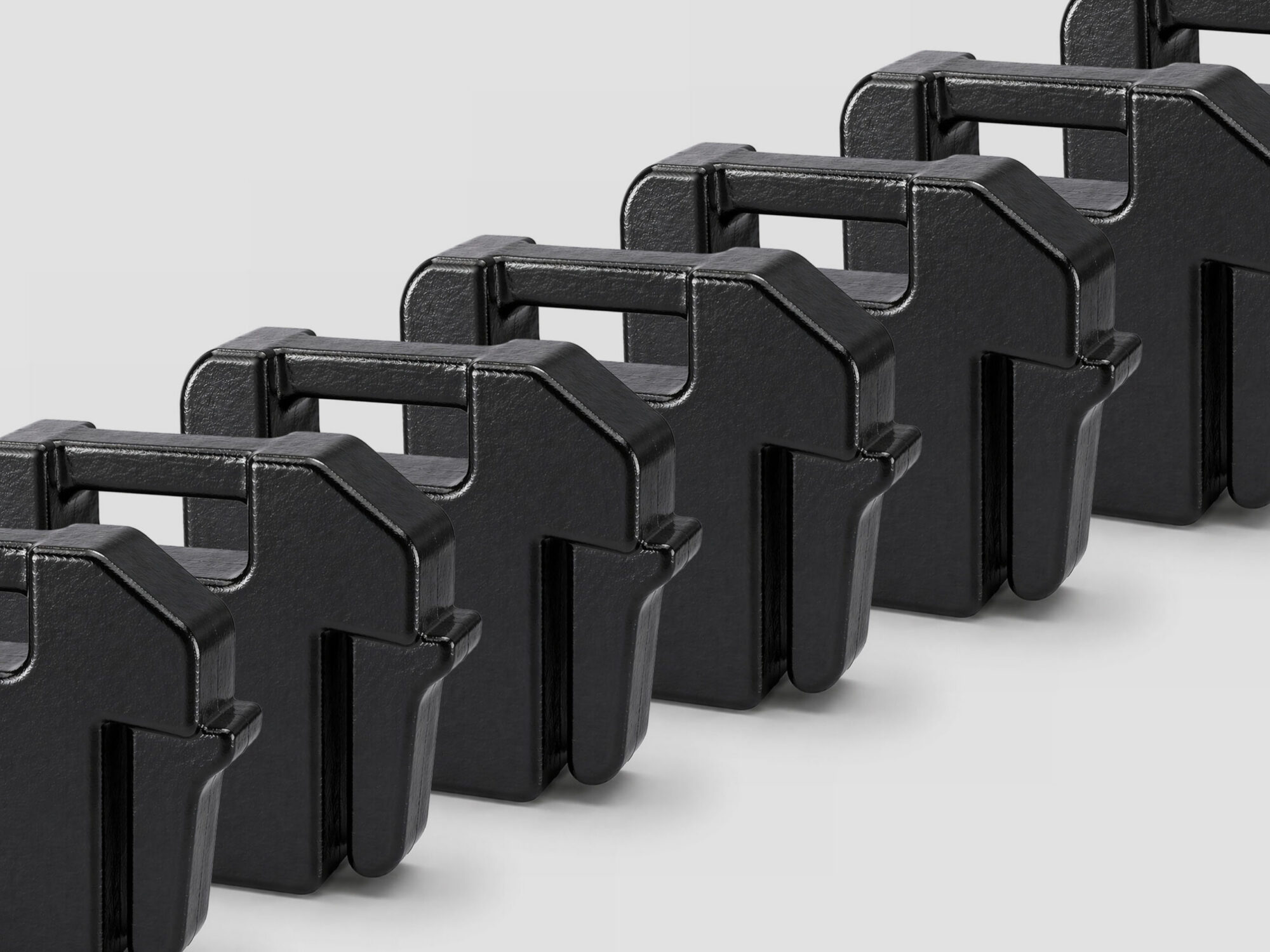 Black suitcase weights in a row