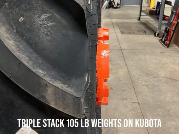 Triple Stack 105 lb Wheel Weights on Kubota M5-111 Protrusion