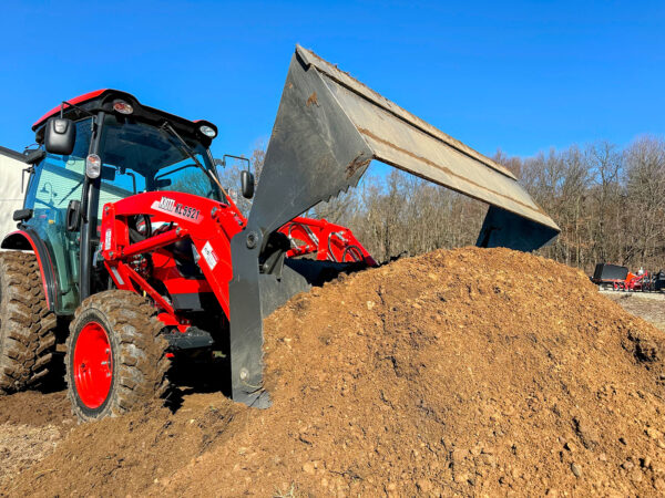 4-N-1 Bucket In Open Position About To Scoop Dirt Pile