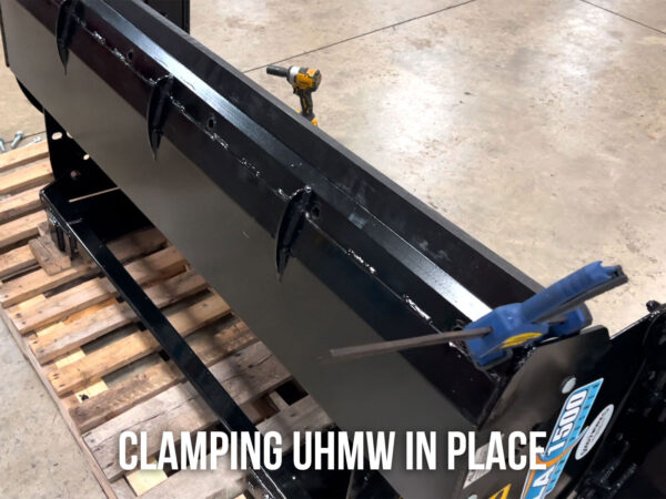 Clamping the UHMW Edge Into Place Before Drilling