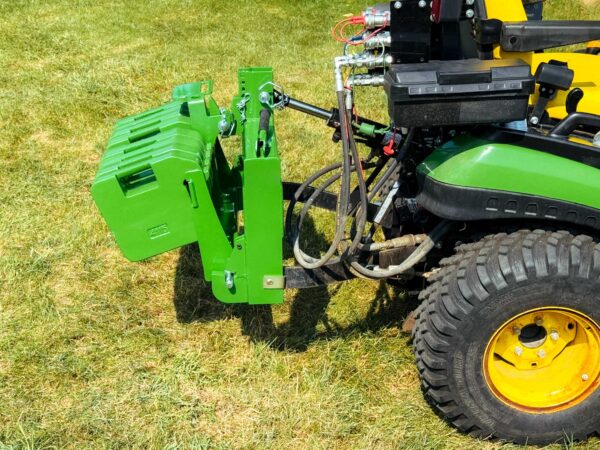 Green VersaBracket with Eight 70 lb Suitcase Weights