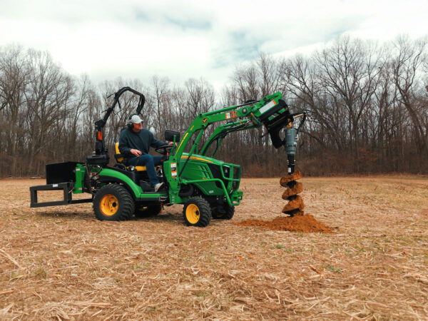 Front View of IronCraft 1500 Hydraulic Auger with Hydraulic Power Pack on John Deere 1025R