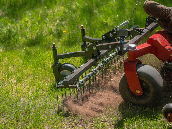 Dethatching Lawn with CMP Dethatcher