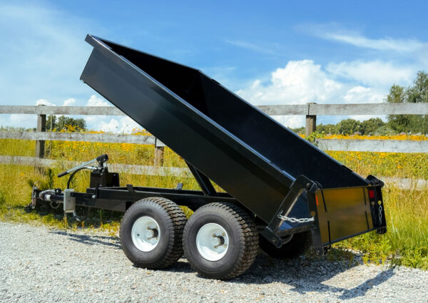 GWT Hydraulic Dump Trailer in Dump Position with TailGate Open at Bottom