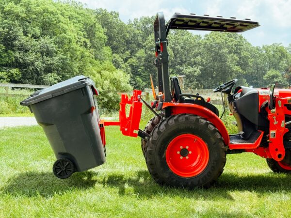 Side View of Tractor with Two Trash Cans on Double Trash Can Hauler