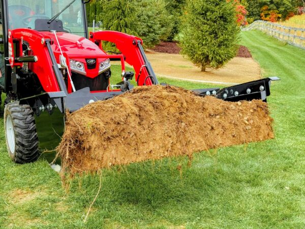 Moving soil with the GWT VersaPusher in the bucket position
