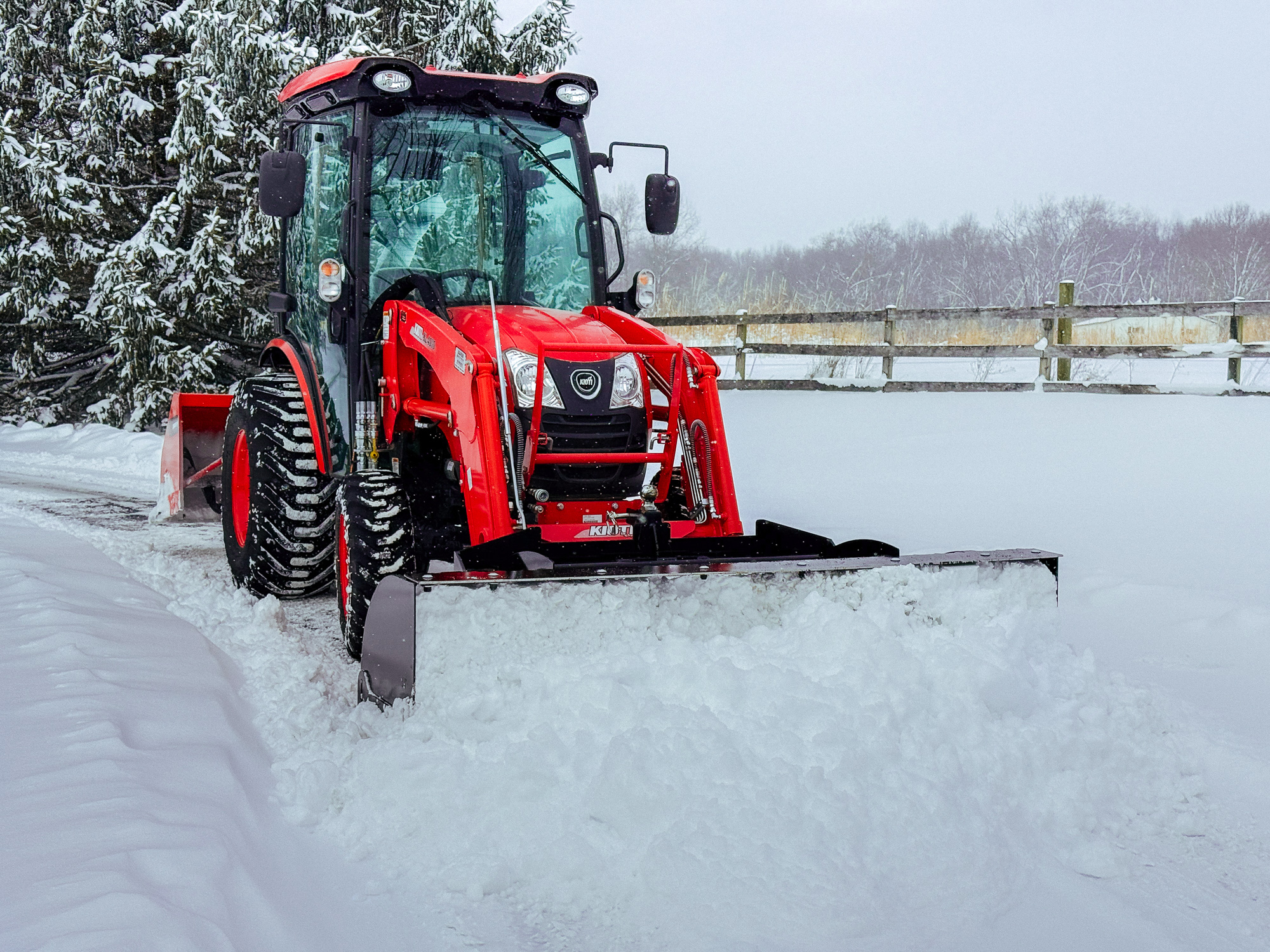 GWT VersaPusher pushing snow